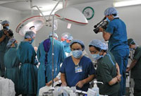 Televised surgery: Jeffrey Stern operates on a cancer patient at Tu Du Hospital. Photo: Courtesy Diane Le