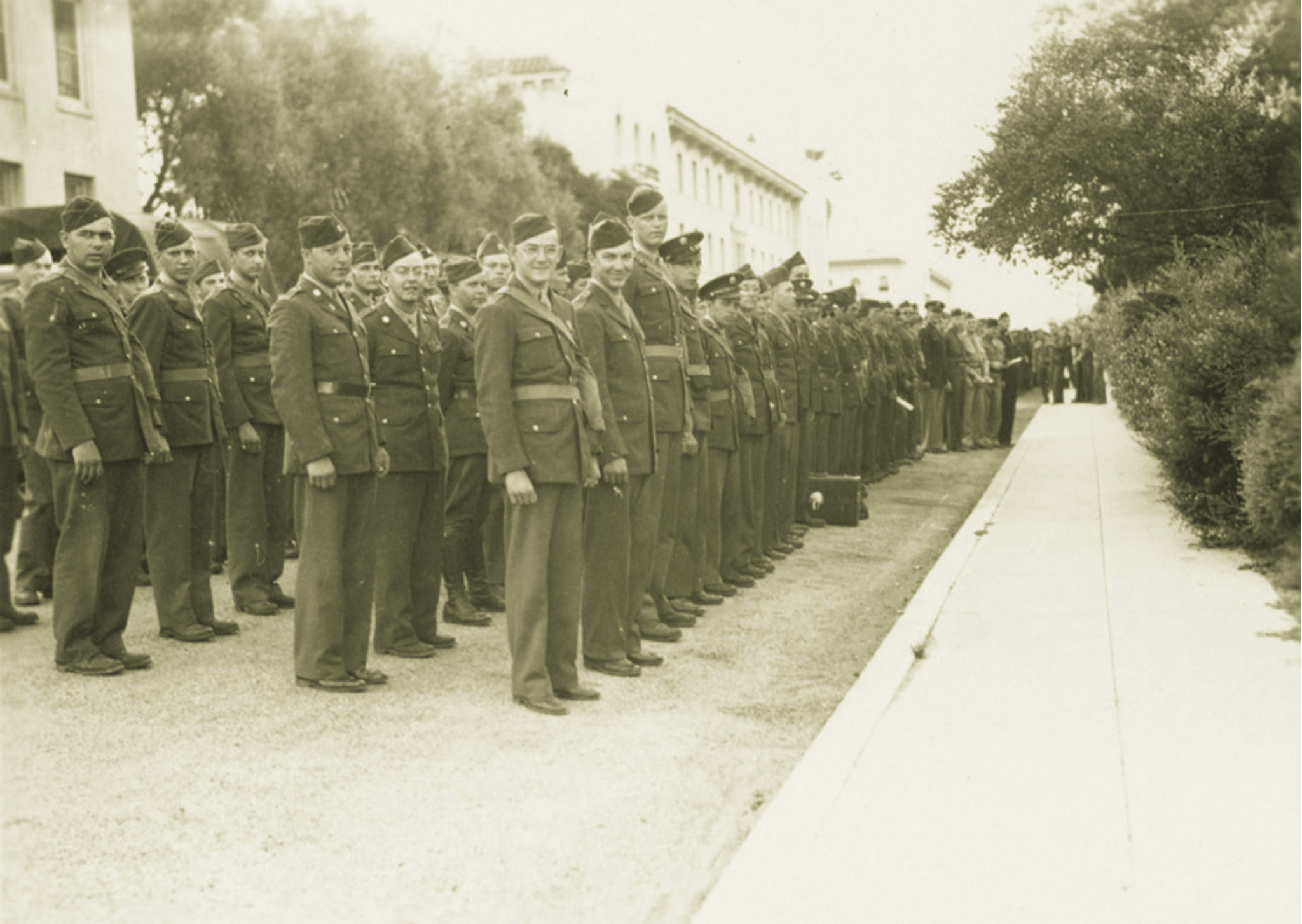 In formation, 1943: Santa Clara cadets in front of the Donohoe Infirmary (now Donohoe Alumni House). Kenna Hall and the Adobe Lodge were reserved exclusively for military science instruction.The following year, 75 percent of the campus was being used to train soldiers. Photo from SCU Archives.