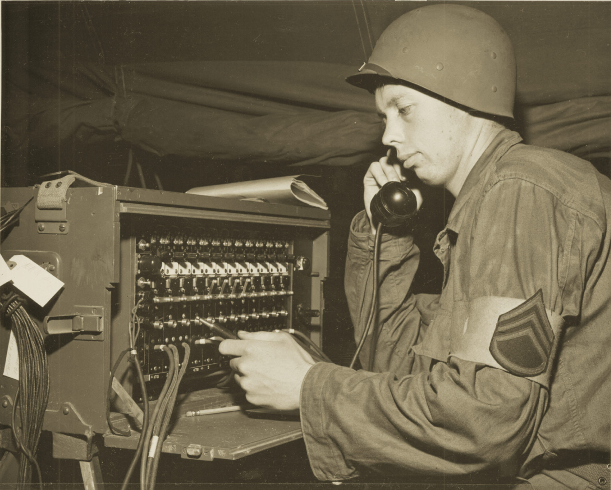 Switchboard operator, 1950: Beginning in 1948, all Santa Clara students enrolled in ROTC their first two years—and most upperclassmen continued with courses rather than risk getting drafted as grunts, especially after the war in Korea began in 1950. Photo from SCU Archives.