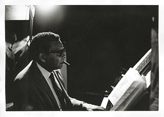 Charles Lampkin plays the piano