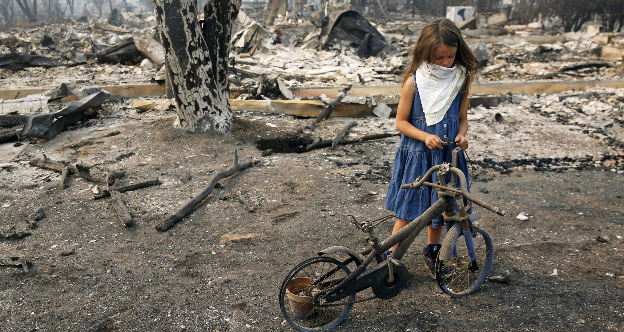 Photo of girl with her bike destroyed in Santa Rosa wildfire touches hearts