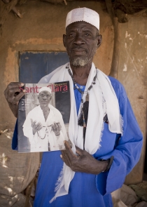 Man Holding Magazine 1