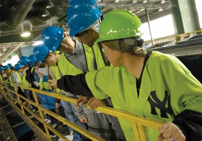 students at recycling facility