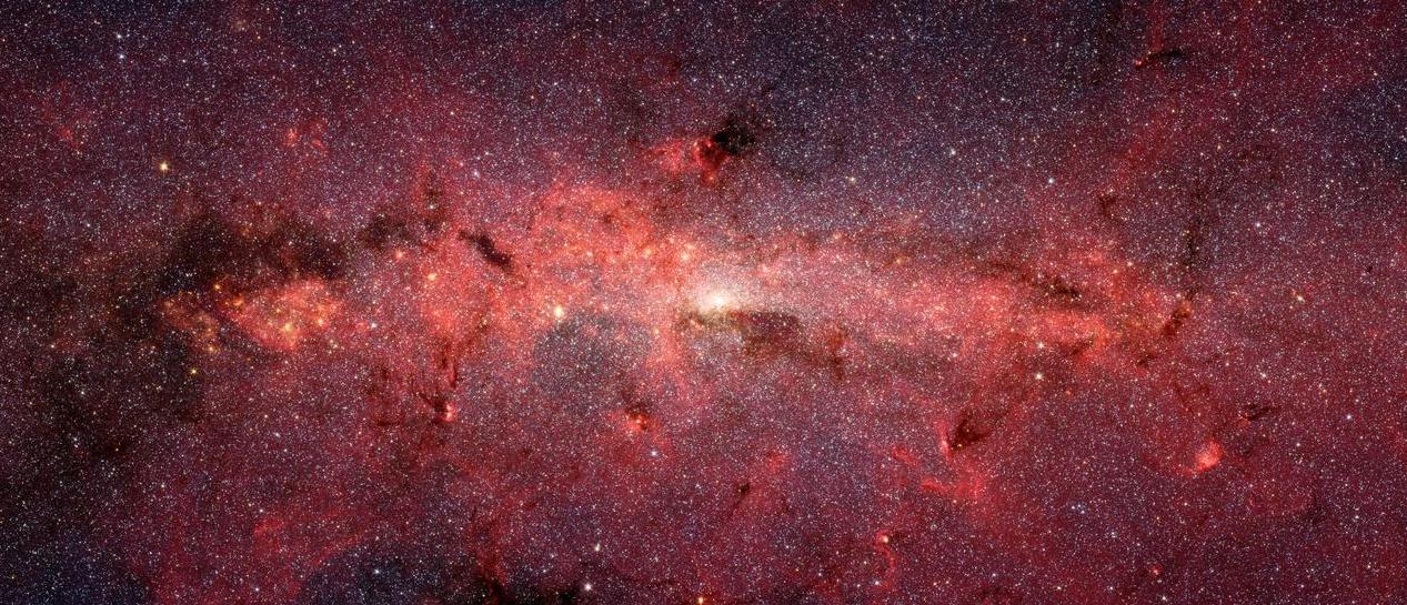 This dazzling infrared image from NASA Spitzer Space Telescope shows hundreds of thousands of stars crowded into the swirling core of our spiral Milky Way galaxy. Courtesy NASA
