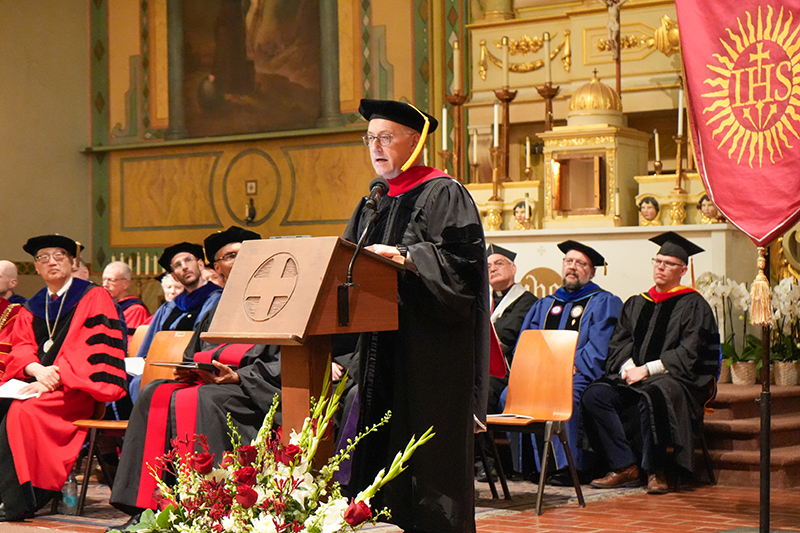 Fr. Spadaro stands with the dean of JST and the president of SCU in the Mission Church during the 2025 graduation.