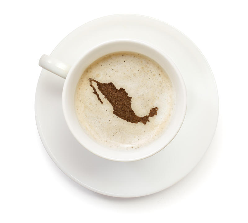 A Cup Of Coffee With Foam And Powder In The Shape Of Mexico. Courtesy Alamy